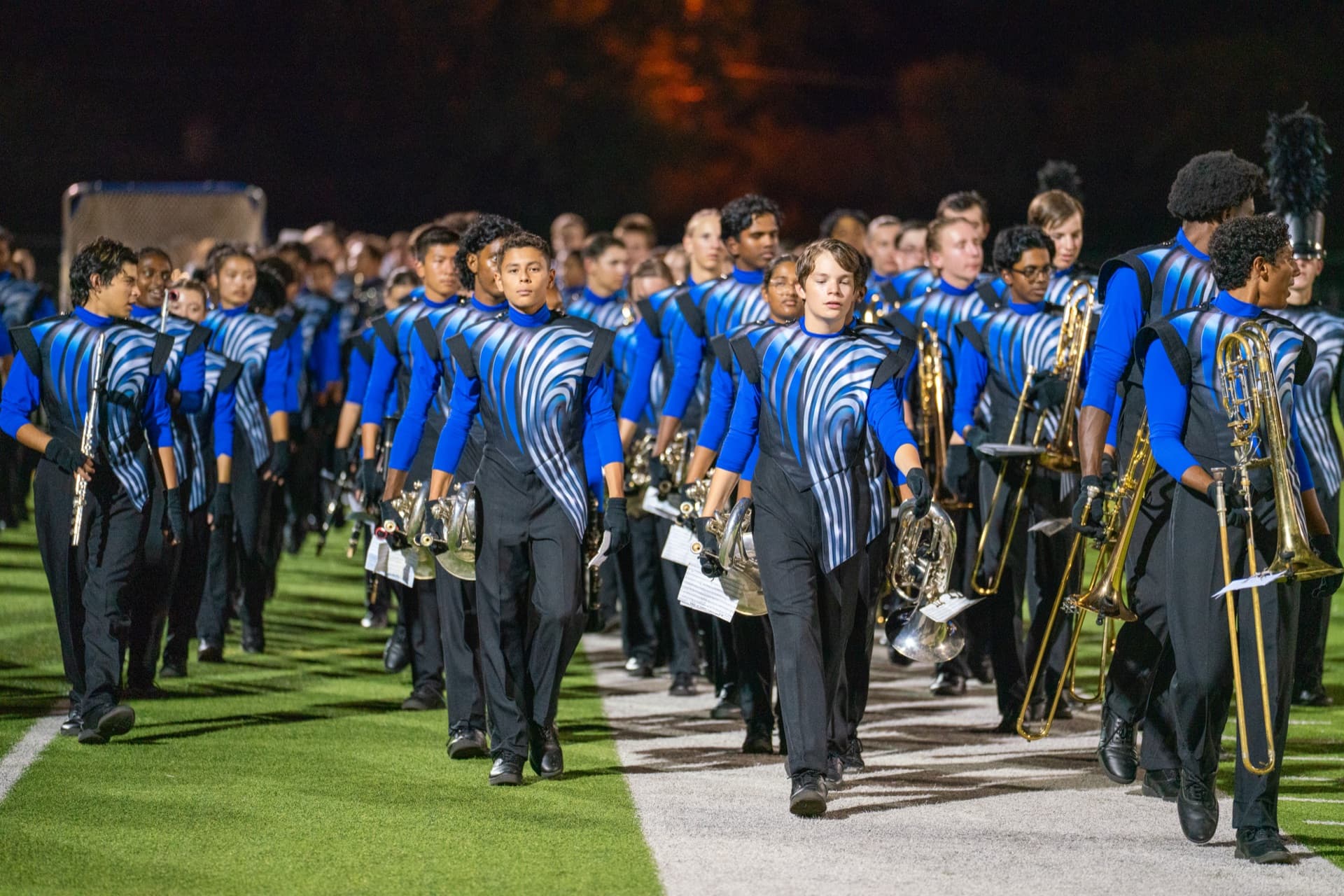 McNeil High School marching band performing at a football game