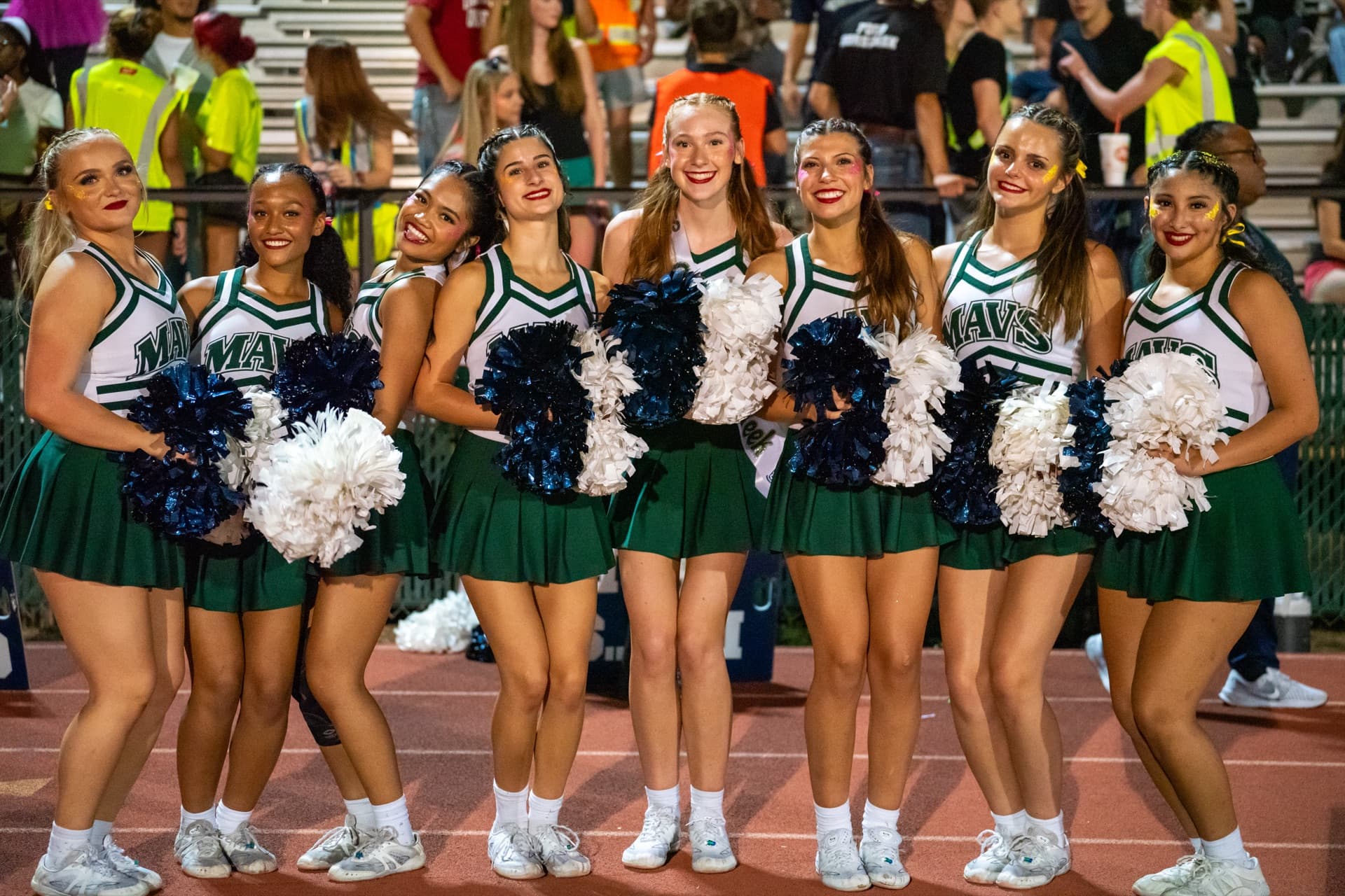 McNeil cheerleaders on the sideline during a football game